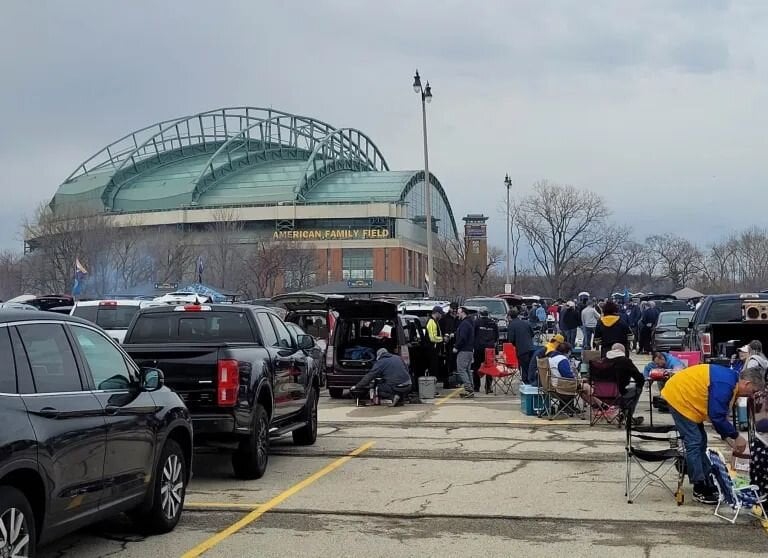 Fans tailgate at American Family Field before the game on Opening Day, April 3, 2023. Photo by Stan Kosek.