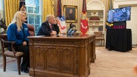 Resolute desk and occupant