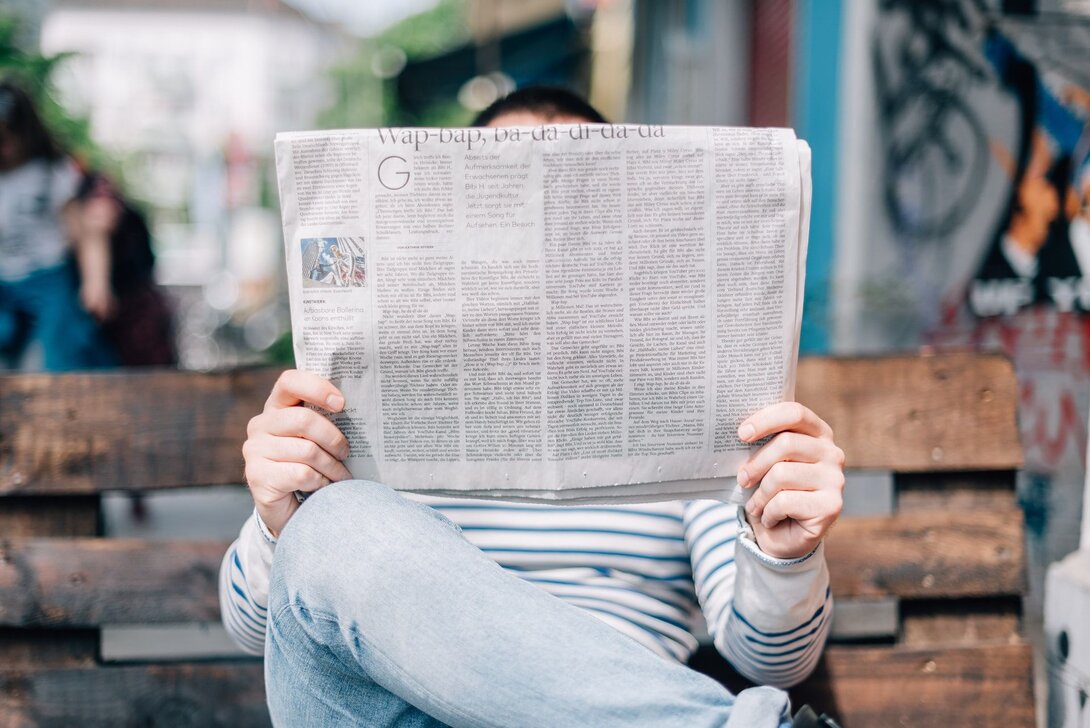 Man Reading Newspaper